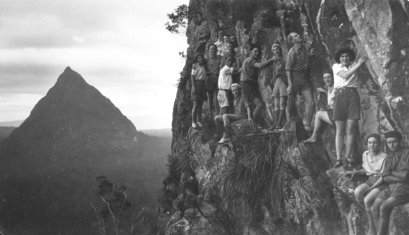 early adventurers on the side of a mountain