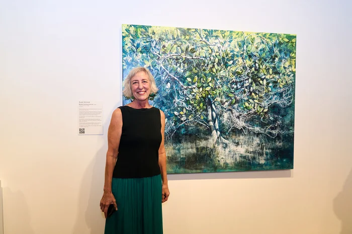 Local winner Susan Schmidt in front of her winning artwork 'Breathe'