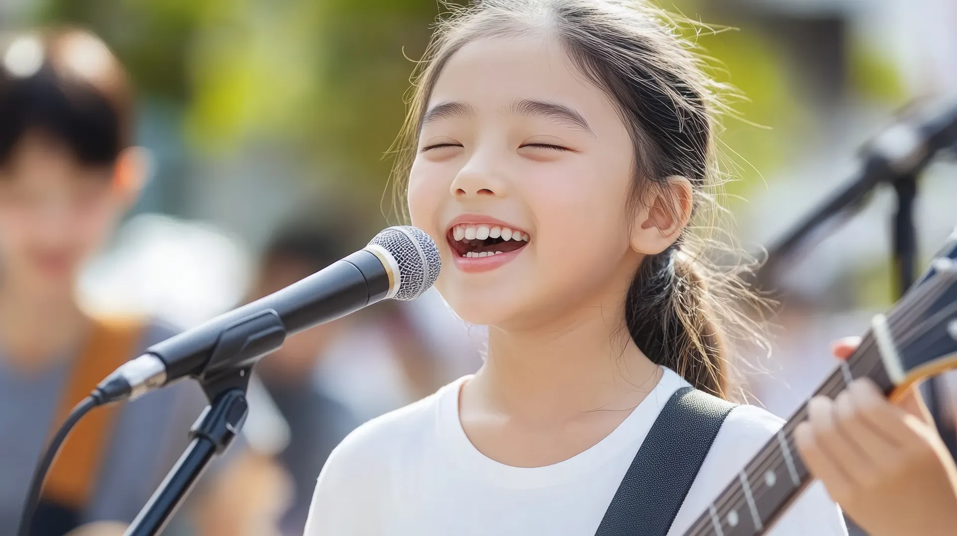 Young girl playing the guitar