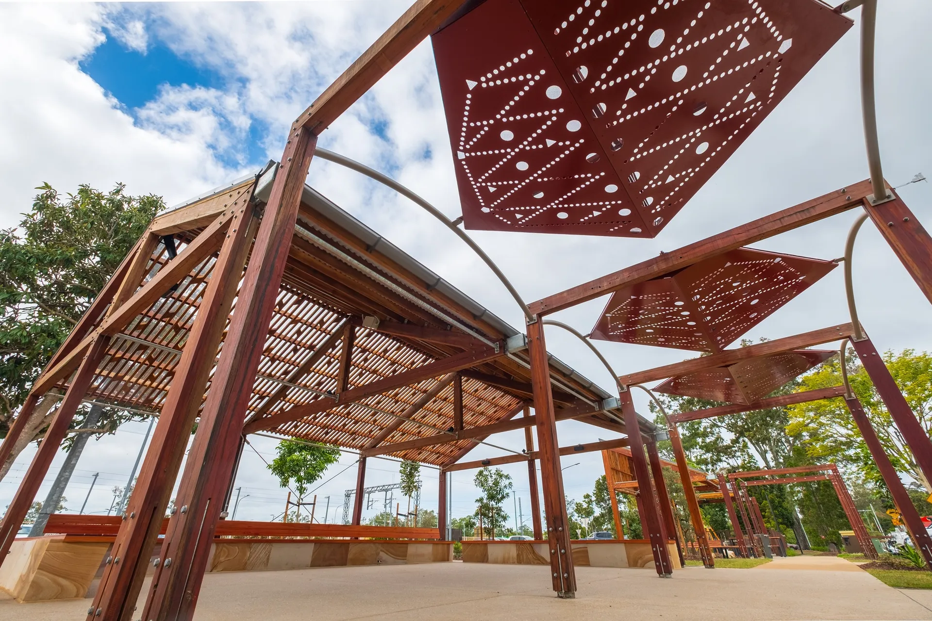 Geometric pods that provide shade during the day and feature lighting at night