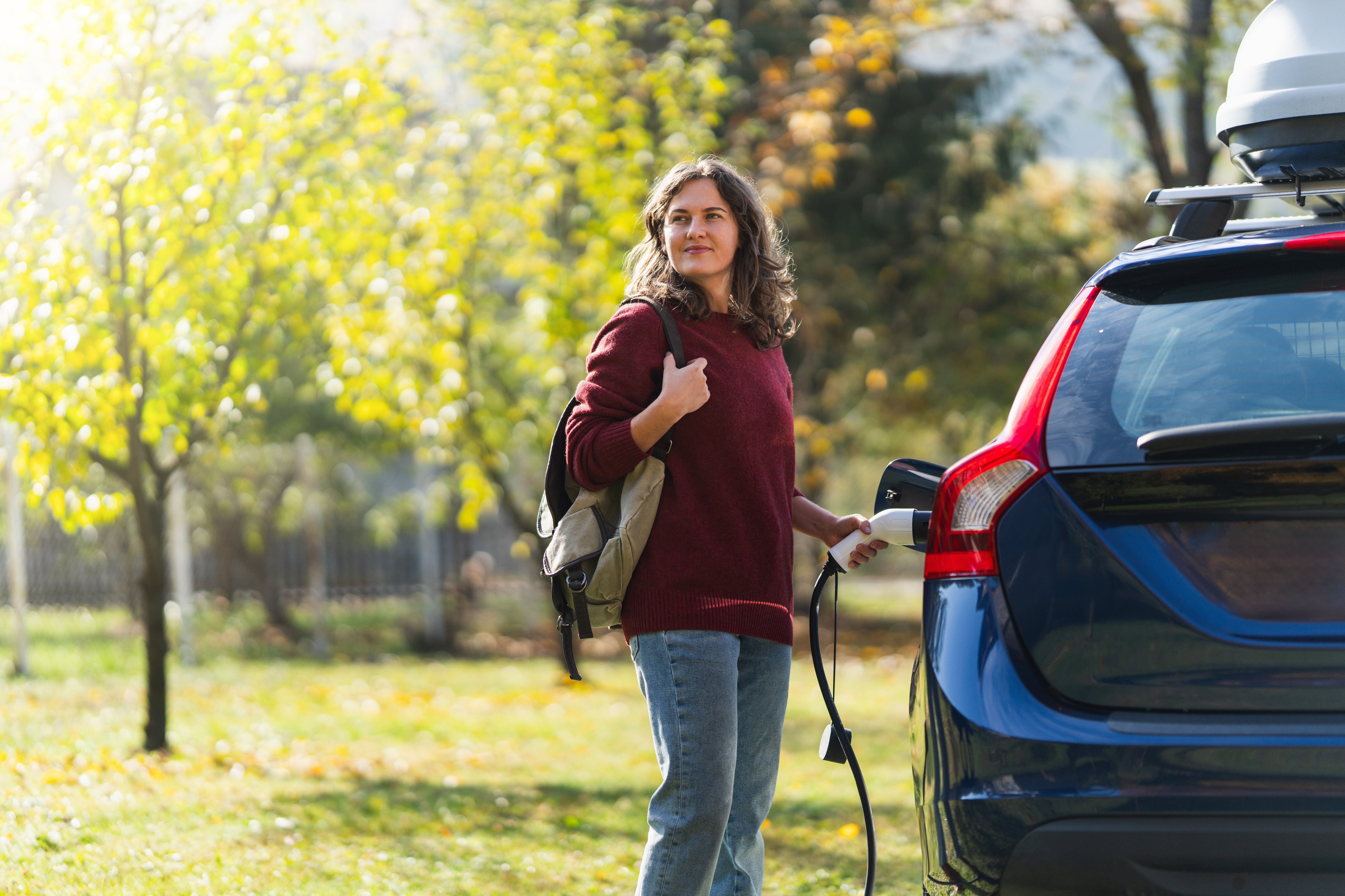woman charging an EV