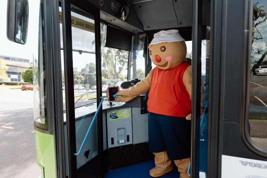 Gingerbread man exiting TransLink bus 631. 