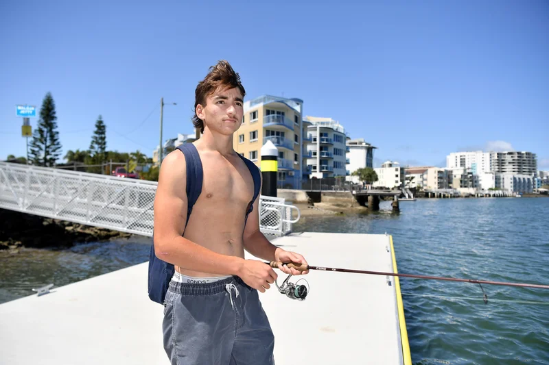 Man fishing off the new Maloja Pontoon, Caloundra.