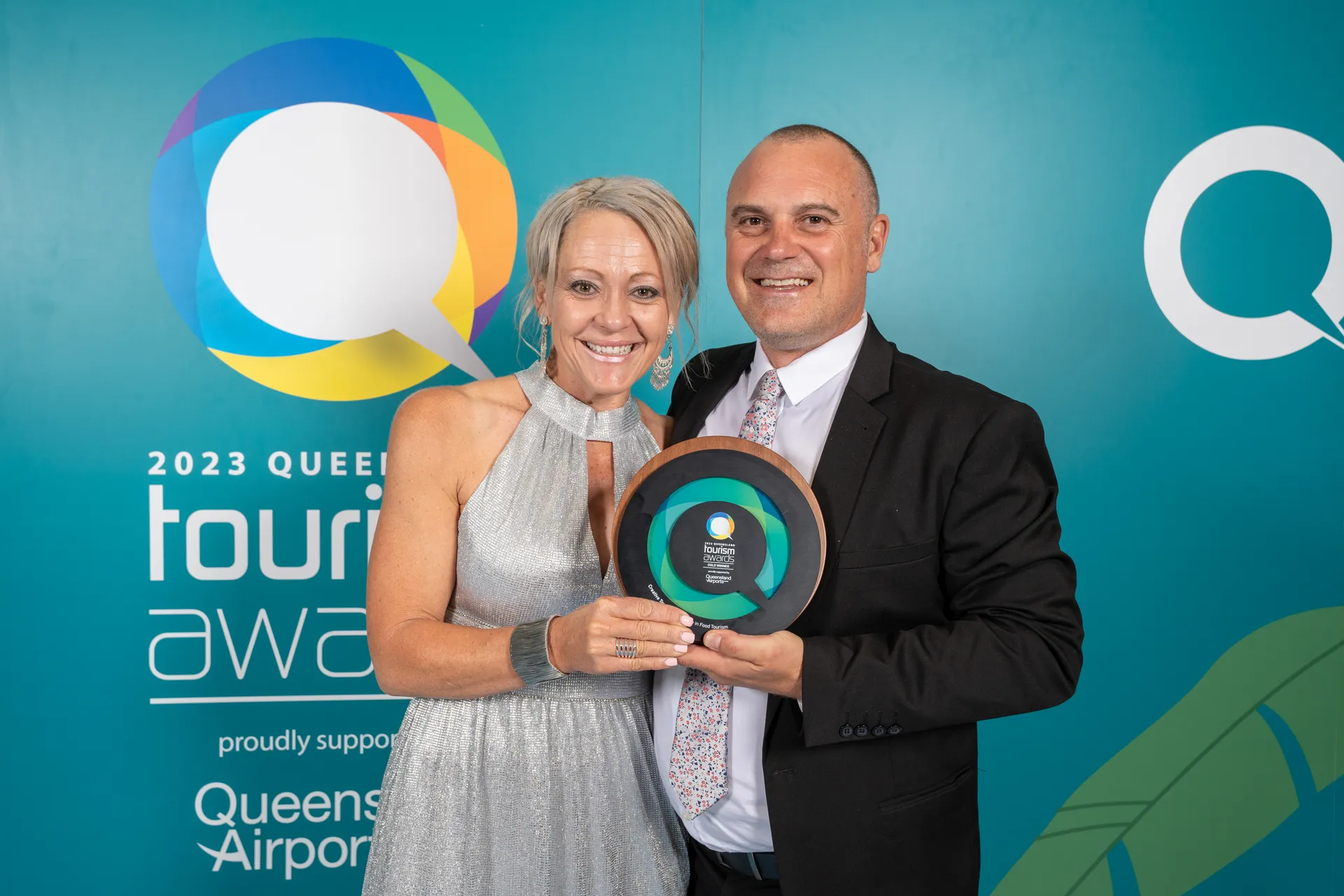 Creative Tours holding their Queensland Tourism award.