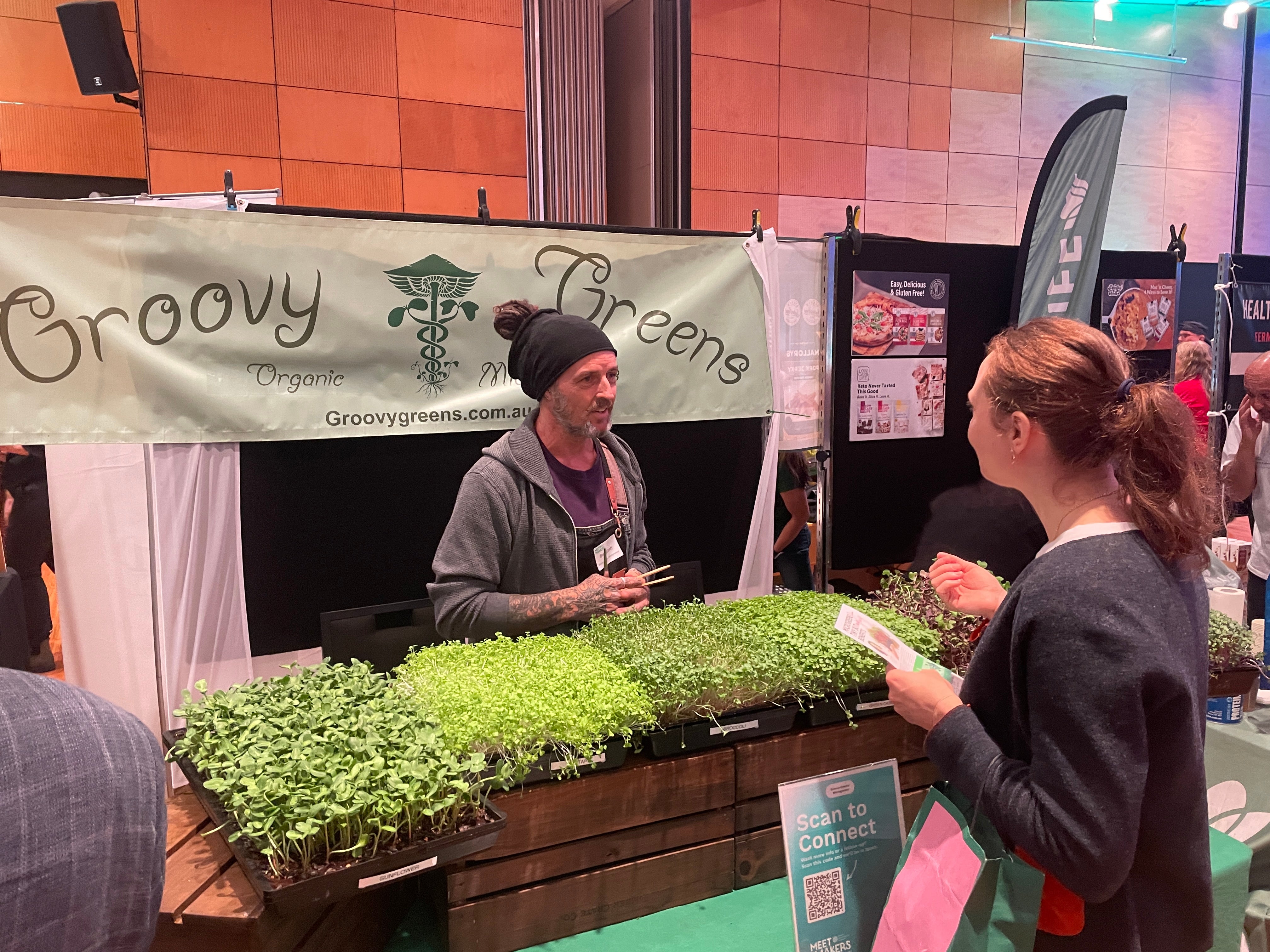 Meet the Makers: Groovy Greens representative talking to a potential buyer