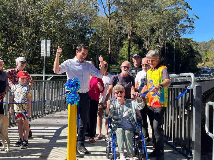 Group photo with community members standing on Seib Road Bridge to officially open it. 