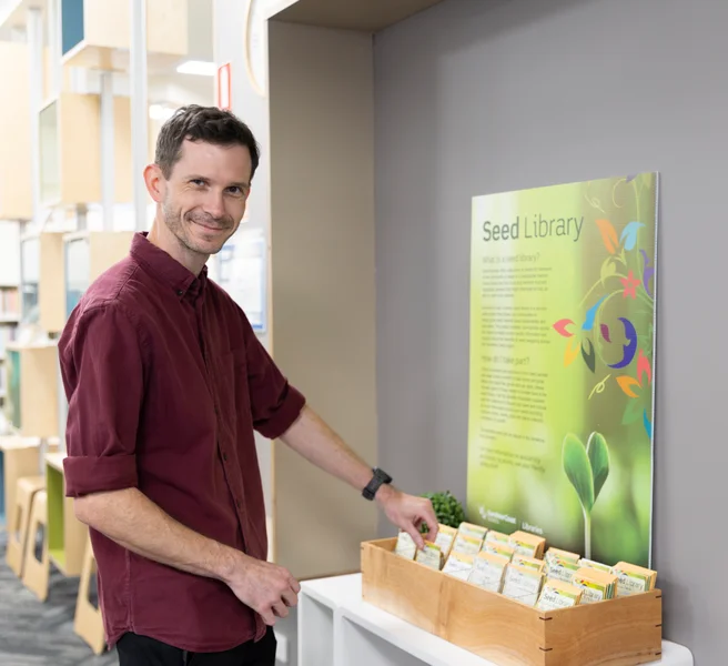 Library member borrowing seeds from the Seed Library