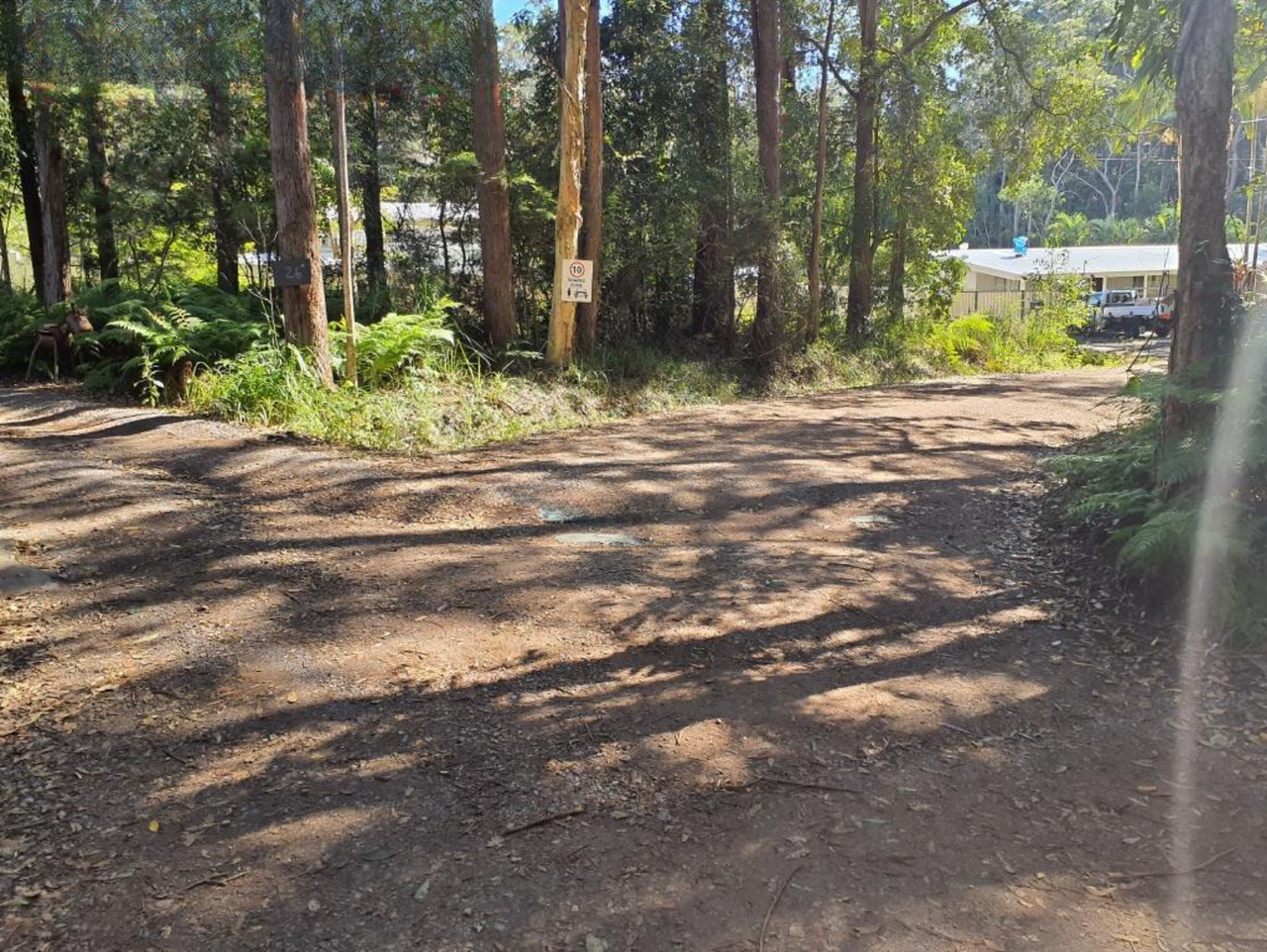 Before: flood damaged Cheviot Road, Palmwoods