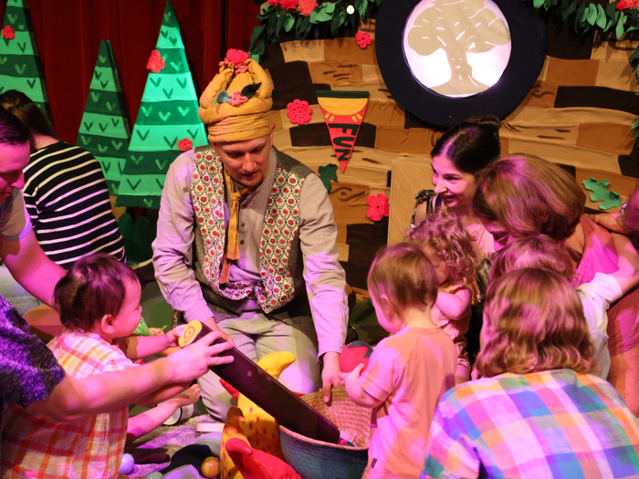 What's in the Woods? Interactive play with babies and toddlers carers playing with the children and an actor helping them understand the different play items. 