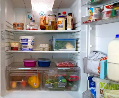A fridge with multiple items inside