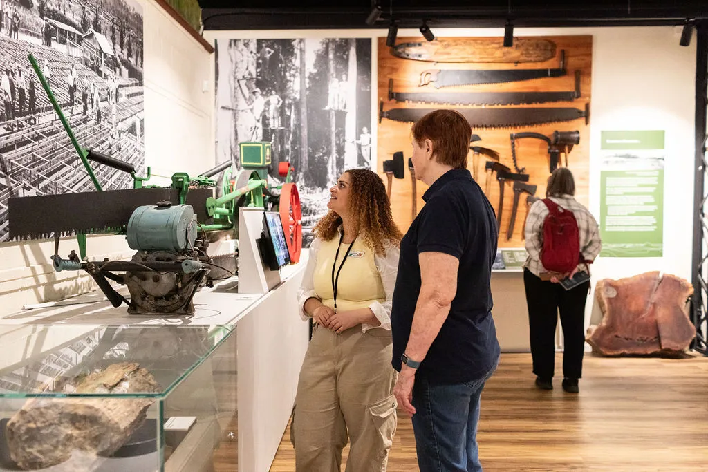 guide and visitor enjoying the Scott Sisters exhibition