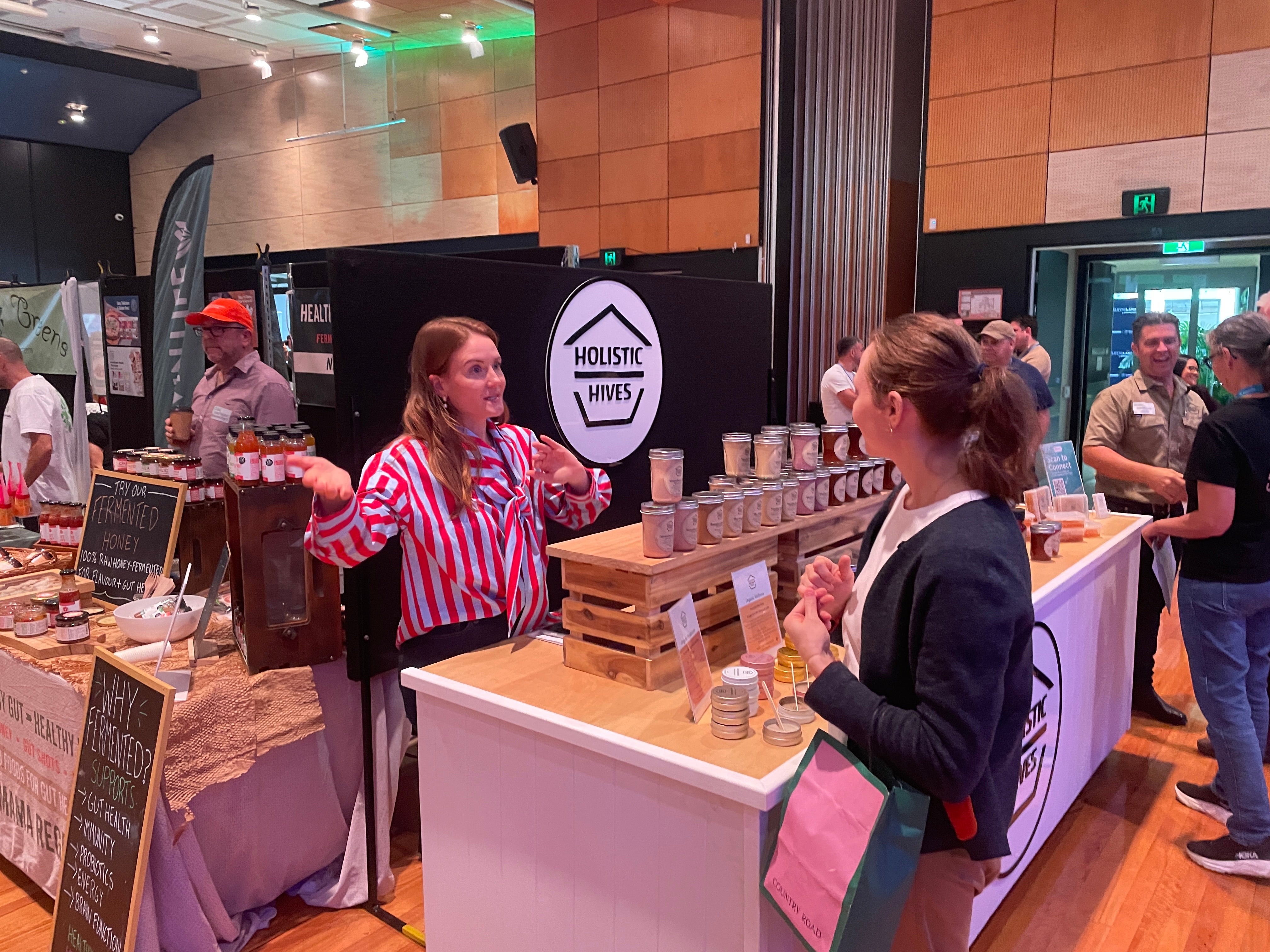 Meet the Makers: Holistic Hives representative talking to a potential buyer