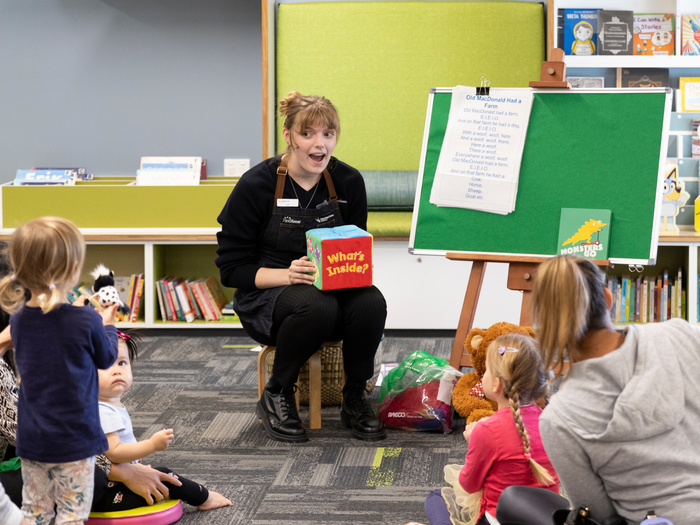 Sunshine Coast Libraries staff engaging with children and families at a session. 