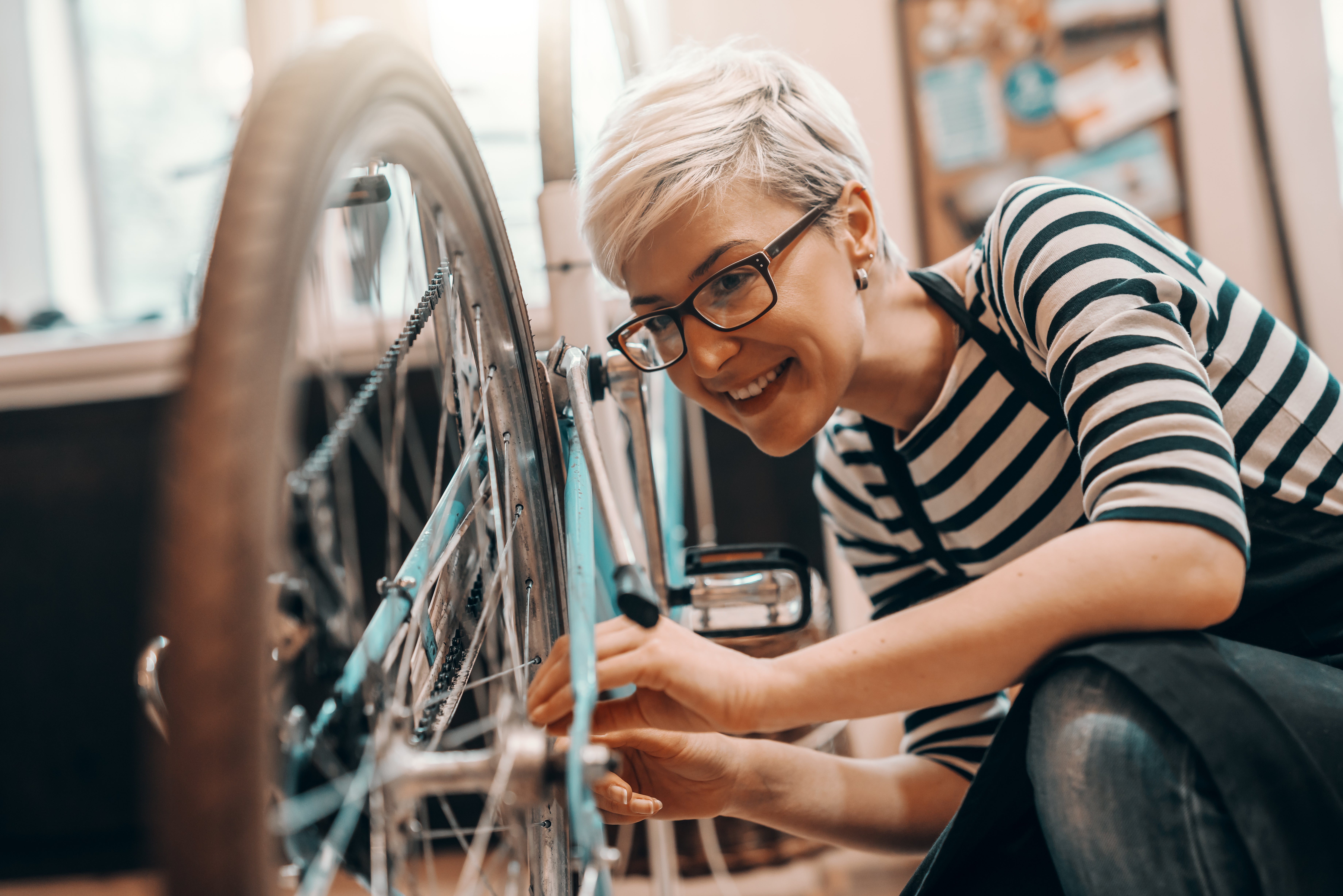 woman checking her bike wheel
