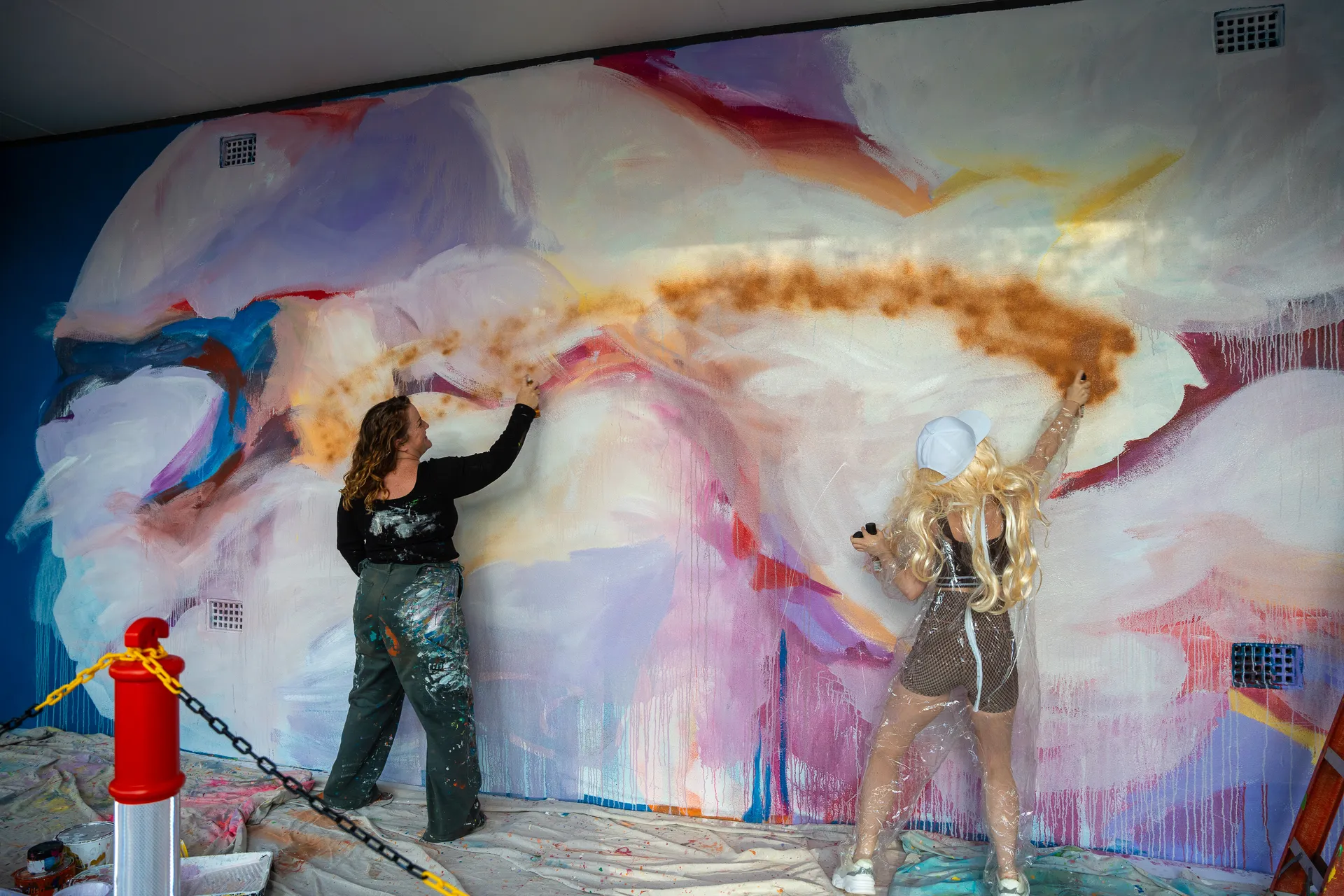 Alison Mooney painting a mural