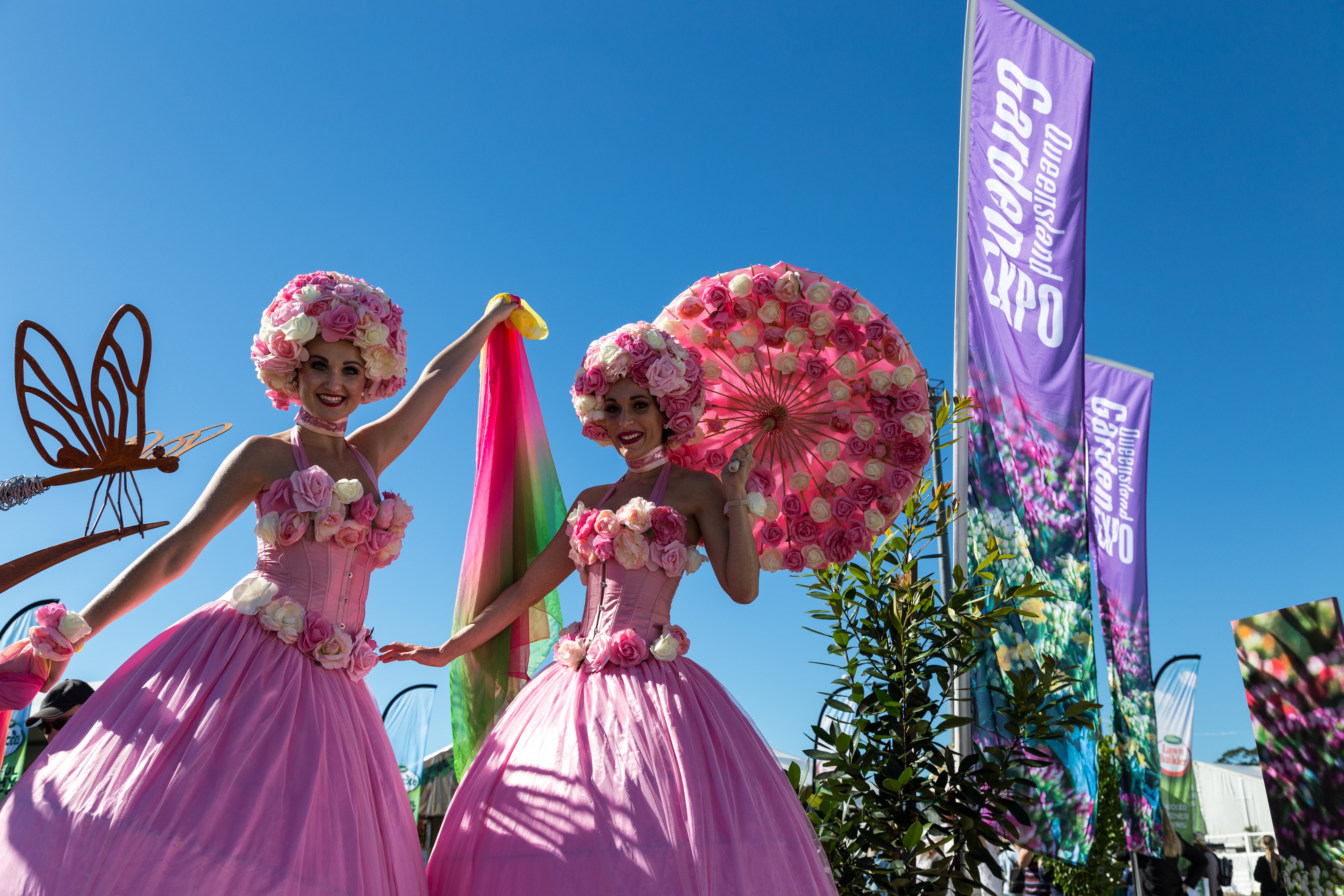 Queensland Garden Expo - roving entertainers dressed in pink with flower headpieces.