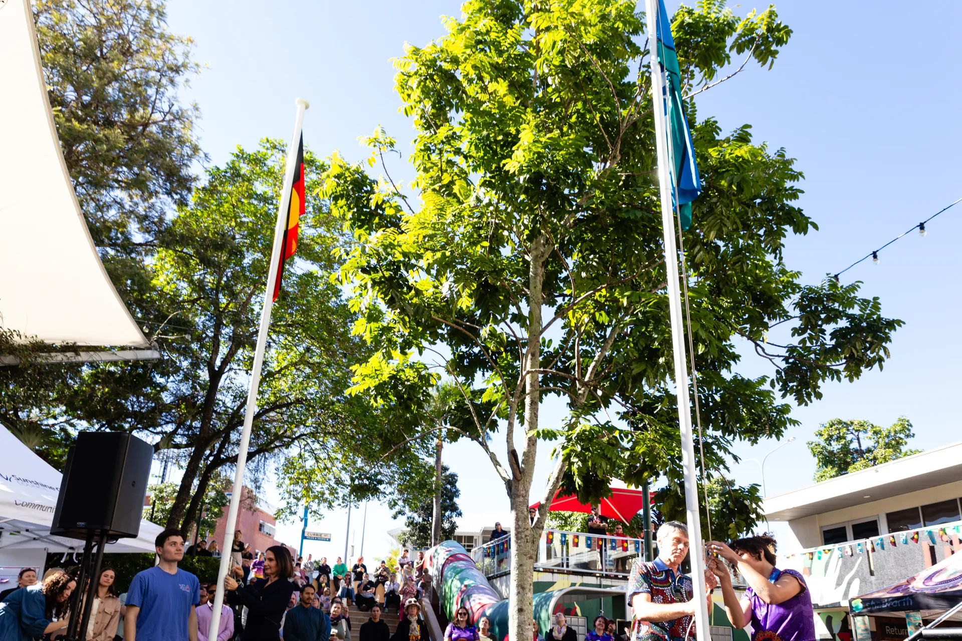 The Aboriginal and Torres Strait Island Flags flying.