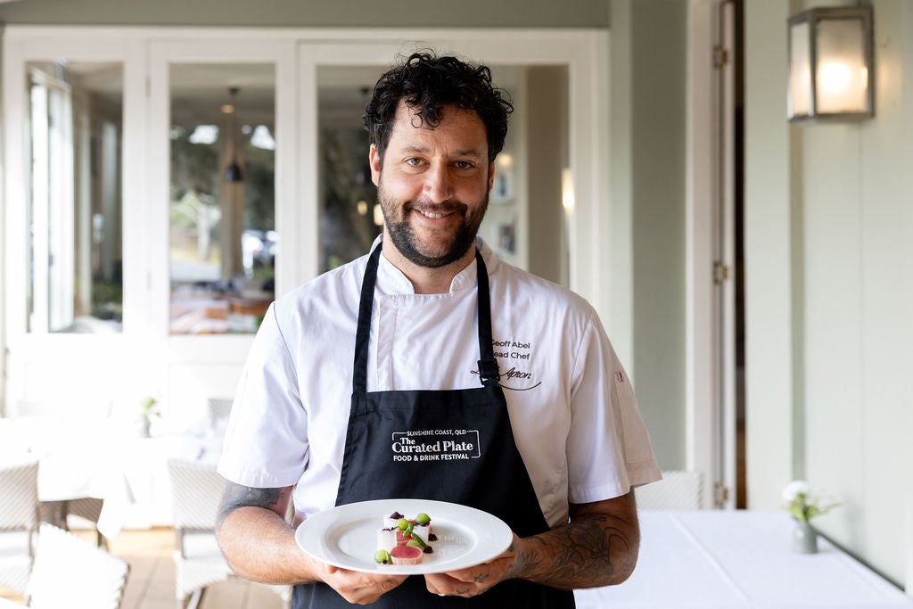 Head Chef Geoff Abel from Spicers Cloverly Estate holding a plate of food