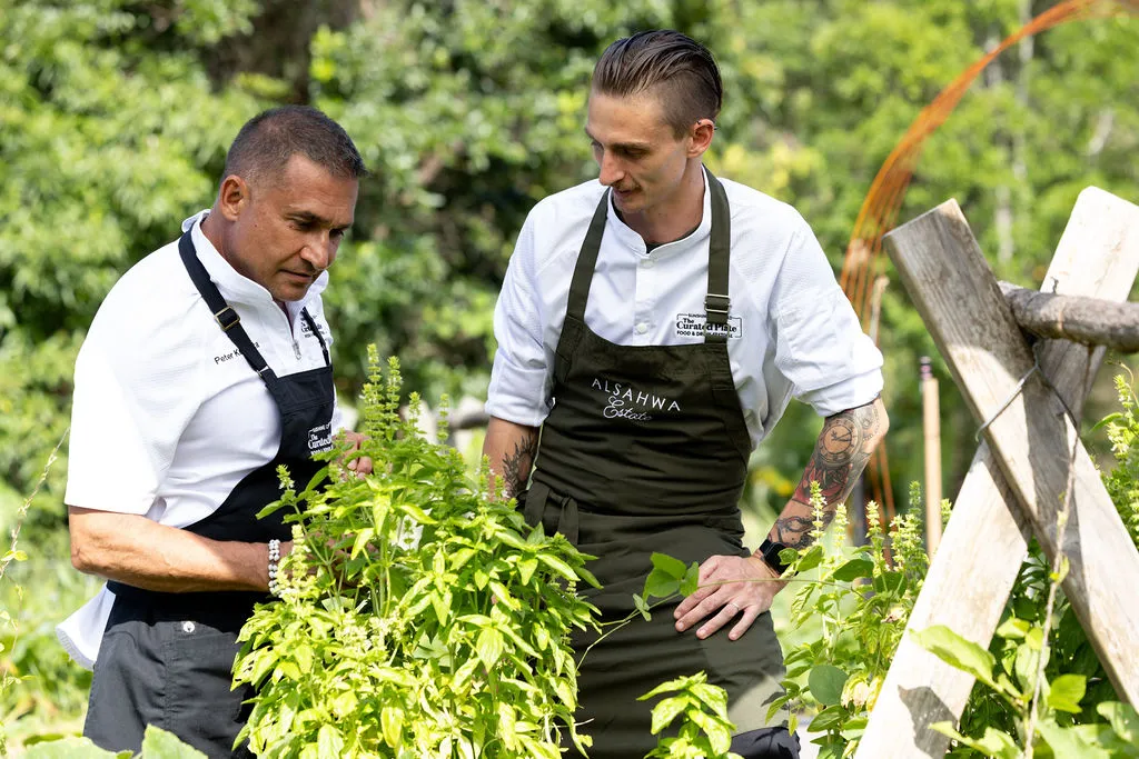 Chef Peter Kuruvita, who is Culinary Director of The Curated Plate, is talking plants and herbs with with Alsahwa Estate Head Chef Mal Meiers.