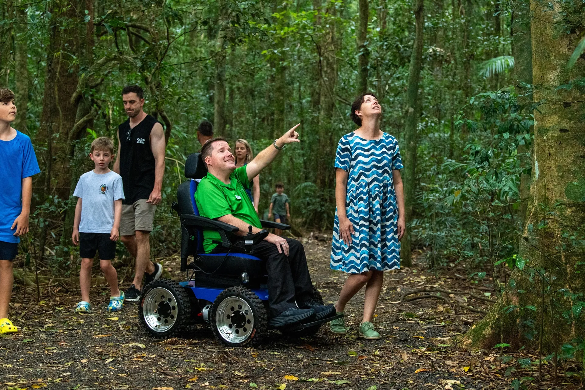 Brendan Somerville, Spinal Life Australia Small Business Inclusion Mentor on the Pademelon track at Mary Cairncross Scenic Reserve, using the new 4WD wheelchair.