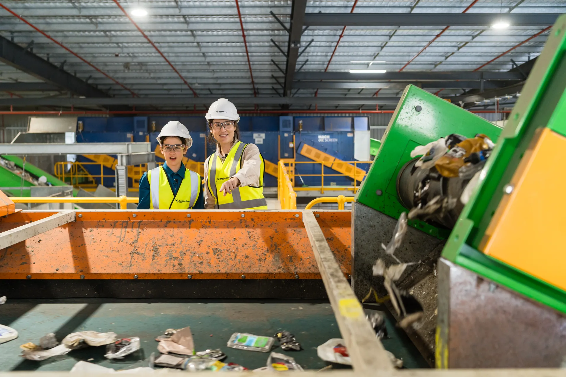 Waste officers looking at sorted waste