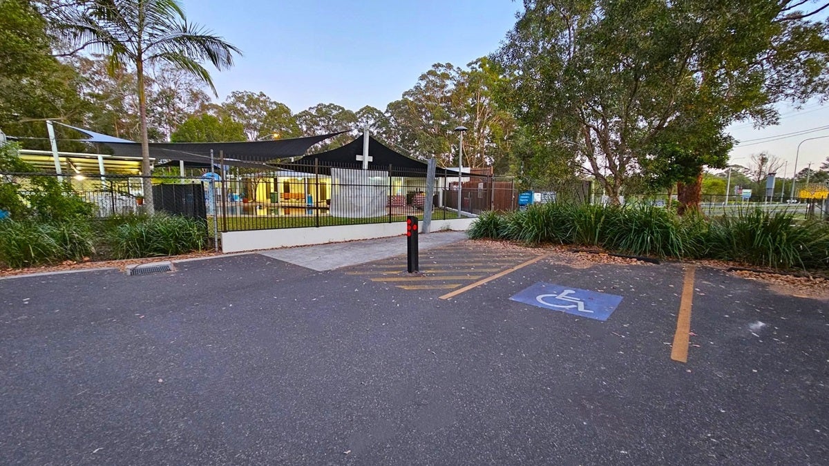 Beerwah Aquatic bitumen car park with signed space for people with disabilities.