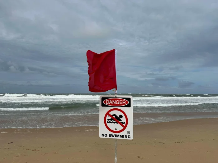 No simming sign marked as Danger with red flag. 