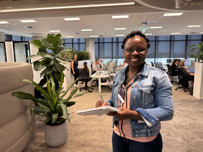 Sonia working with a team at City Hall office