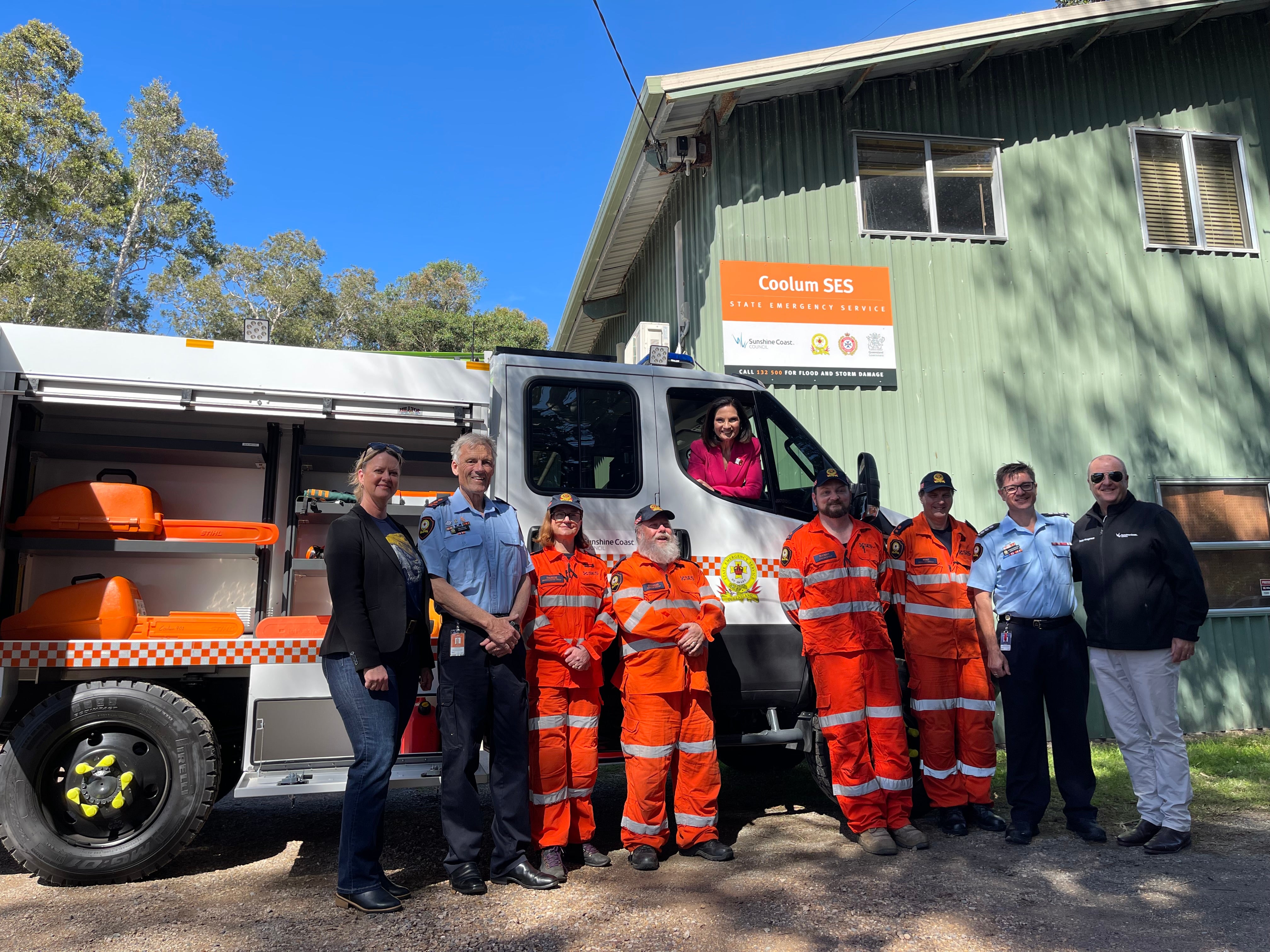 Councillor Suarez stands with a group of SES volunteers in front of the new vehicle. The Mayor is leaning out of the driver seat window.
