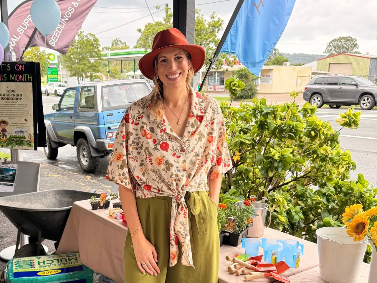 A woman at a market stall.