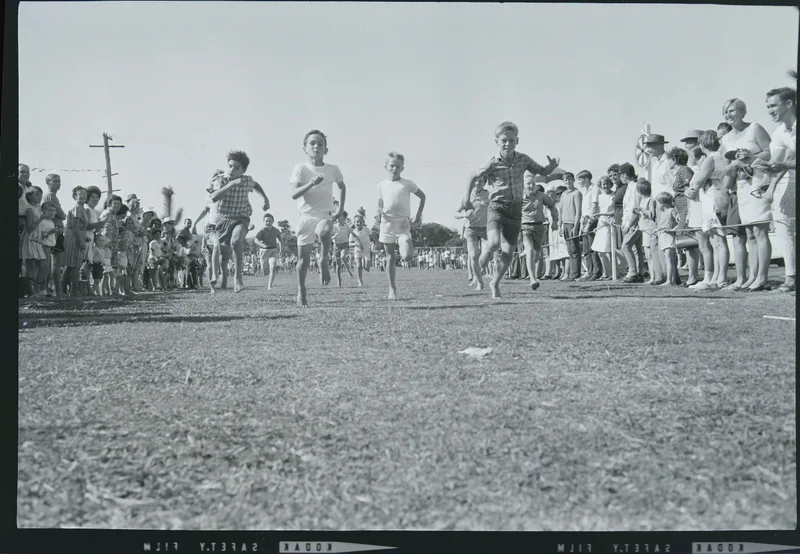 School sports day, boys running for the finishing line