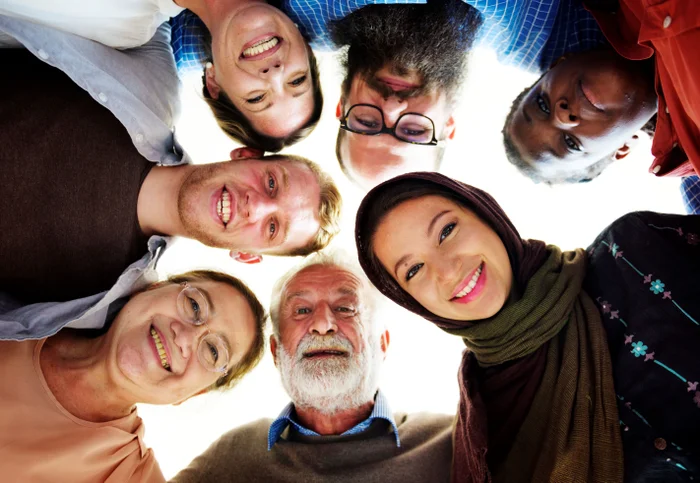 Group of people huddled in a circle