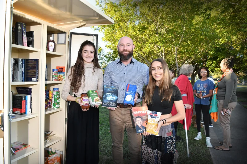 Members of the Eaton Park Community Group join Cr Christian Dickson at their new community pantry.