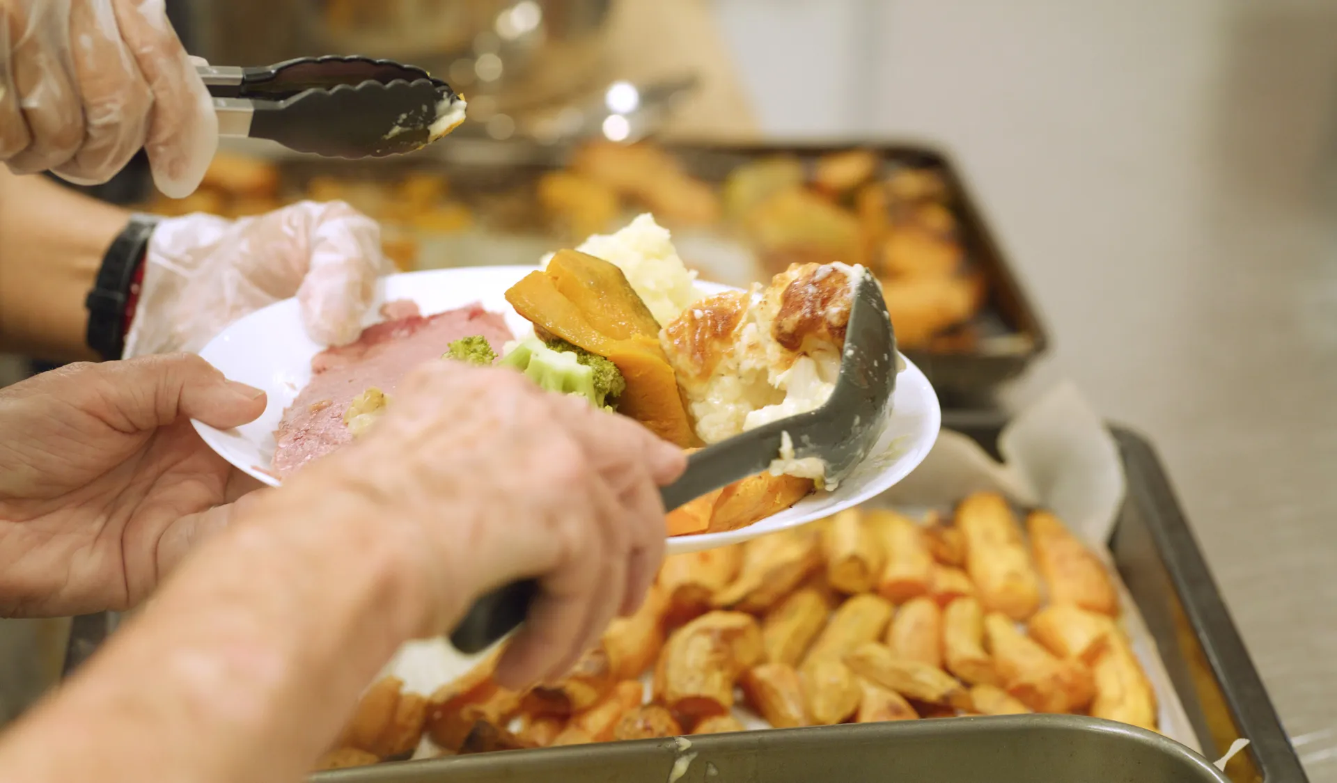 IMAGE%203%20Volunteers%20serve%20up%20community%20meals.jpg