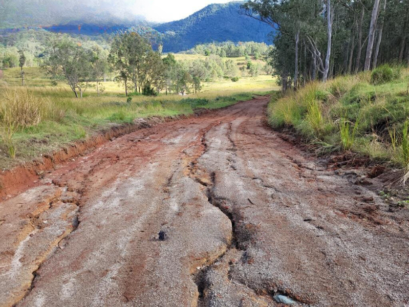 Before repair work: flood damaged Grigor Road in Conondale