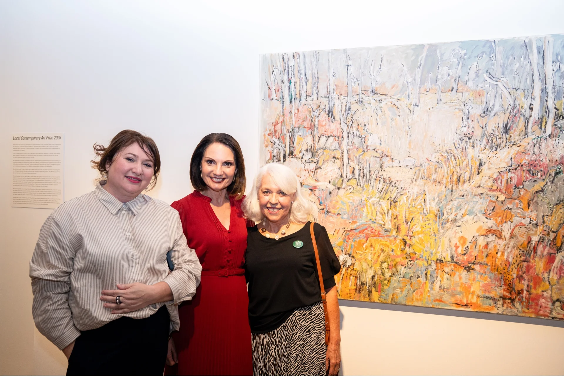 Claire Sourgnes, guest judge, Mayor Rosanna Natoli and artist Sam Vatovey with Best in Show winning artwork 'Mount Emu Walk'. Photo by Patrick Want, Volere Studio.