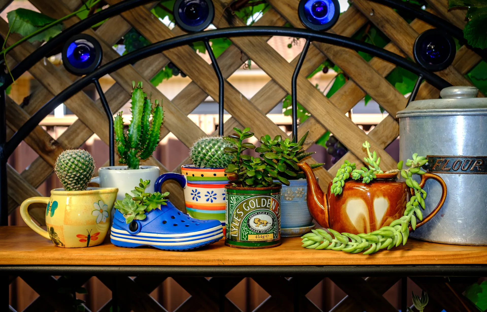 A great example of everyday objects reused as garden planters.