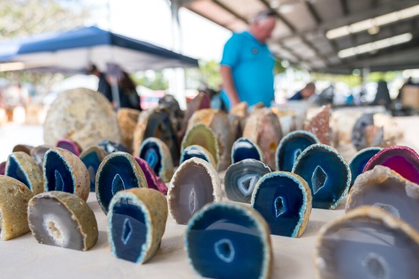 A table of beautiful gem stones - blue, grey and pink in colour
