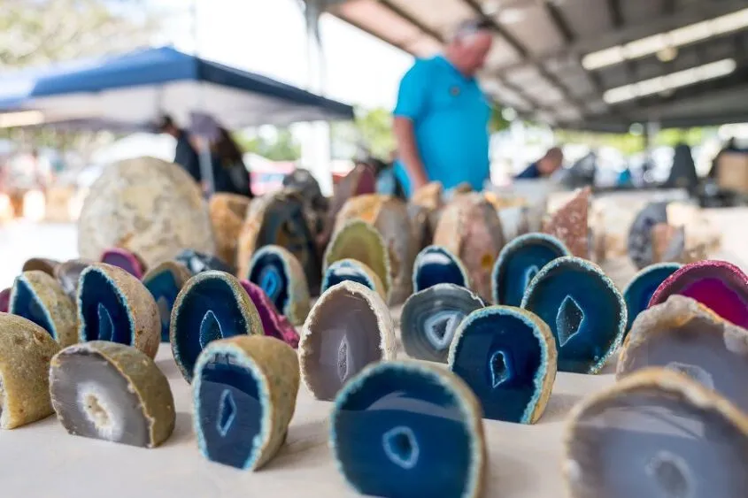 A table of beautiful gem stones - blue, grey and pink in colour