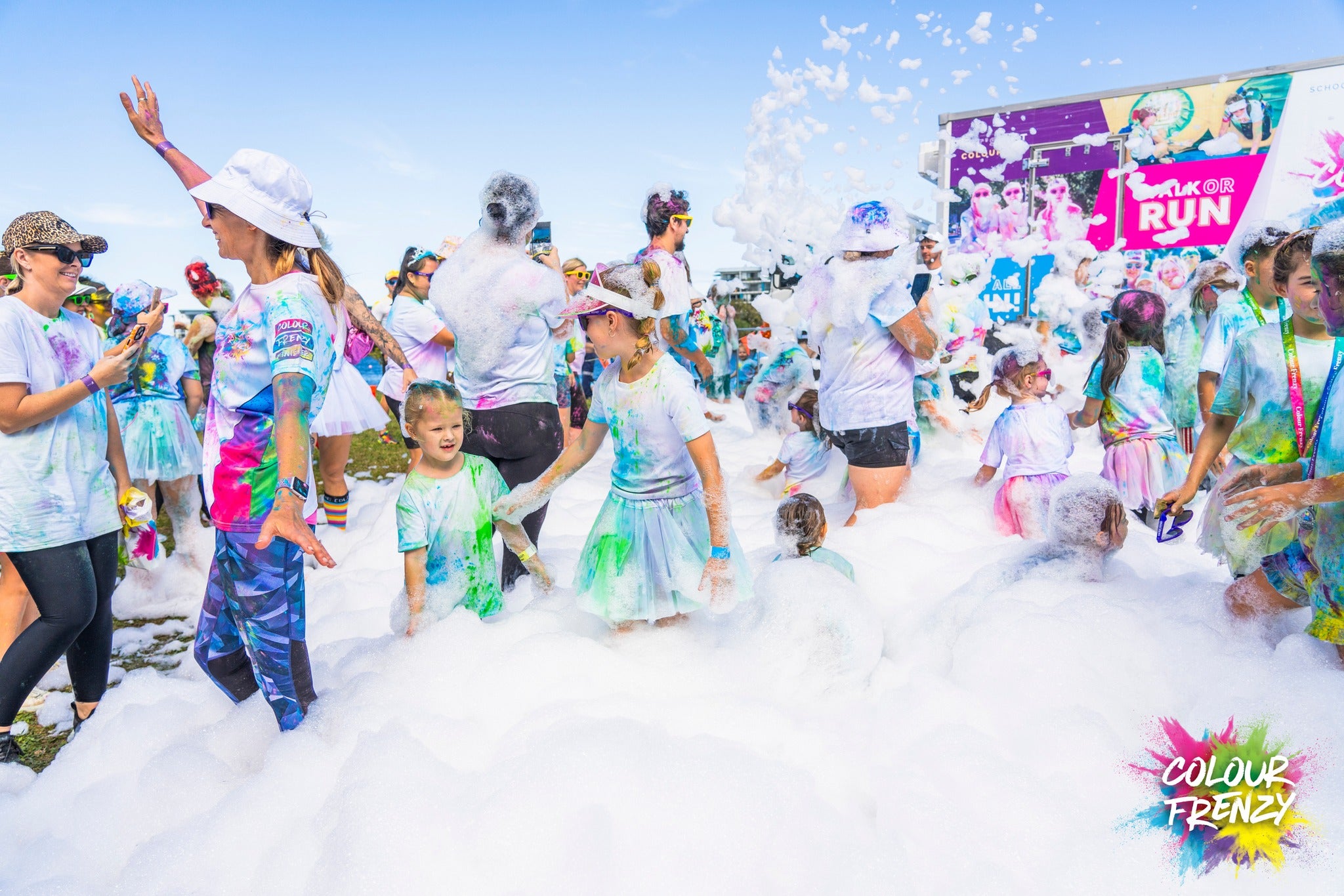 Childrena nd adults participating in the outdoor colour run