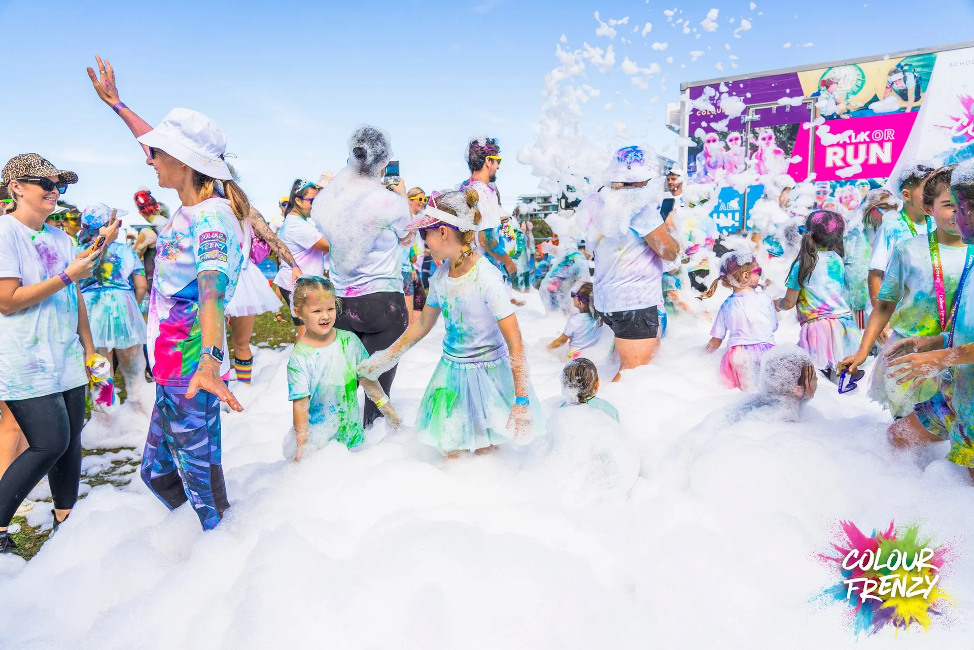 Childrena nd adults participating in the outdoor colour run