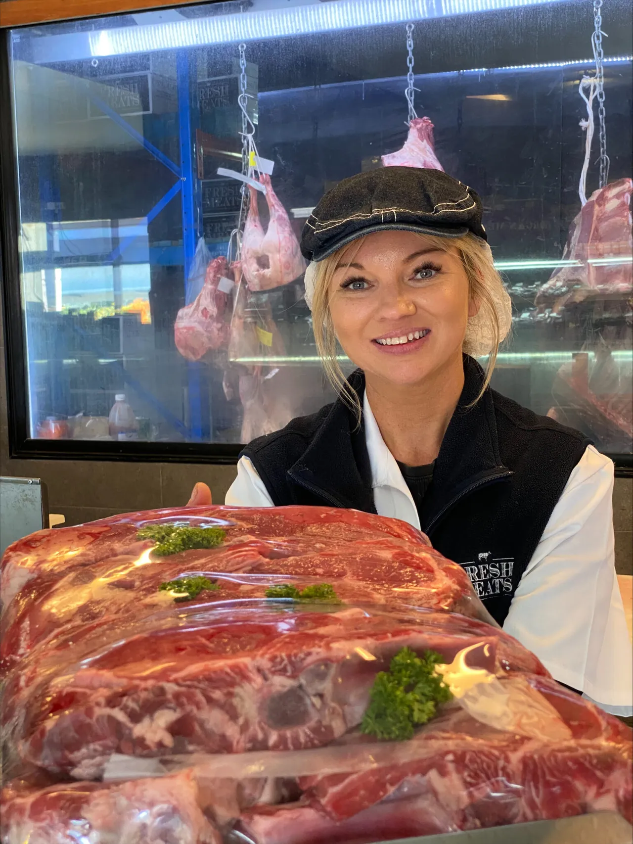 Fresh-Meats-employee-holding-meat-1537x2048.jpeg