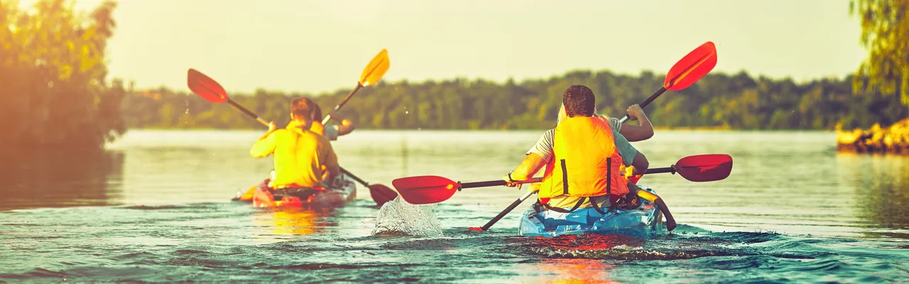 People in canoes paddling