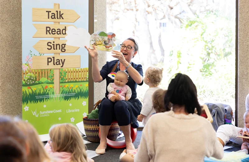 Storytime and Rhymetime sessions with library staff reading a book to children and their parents. 