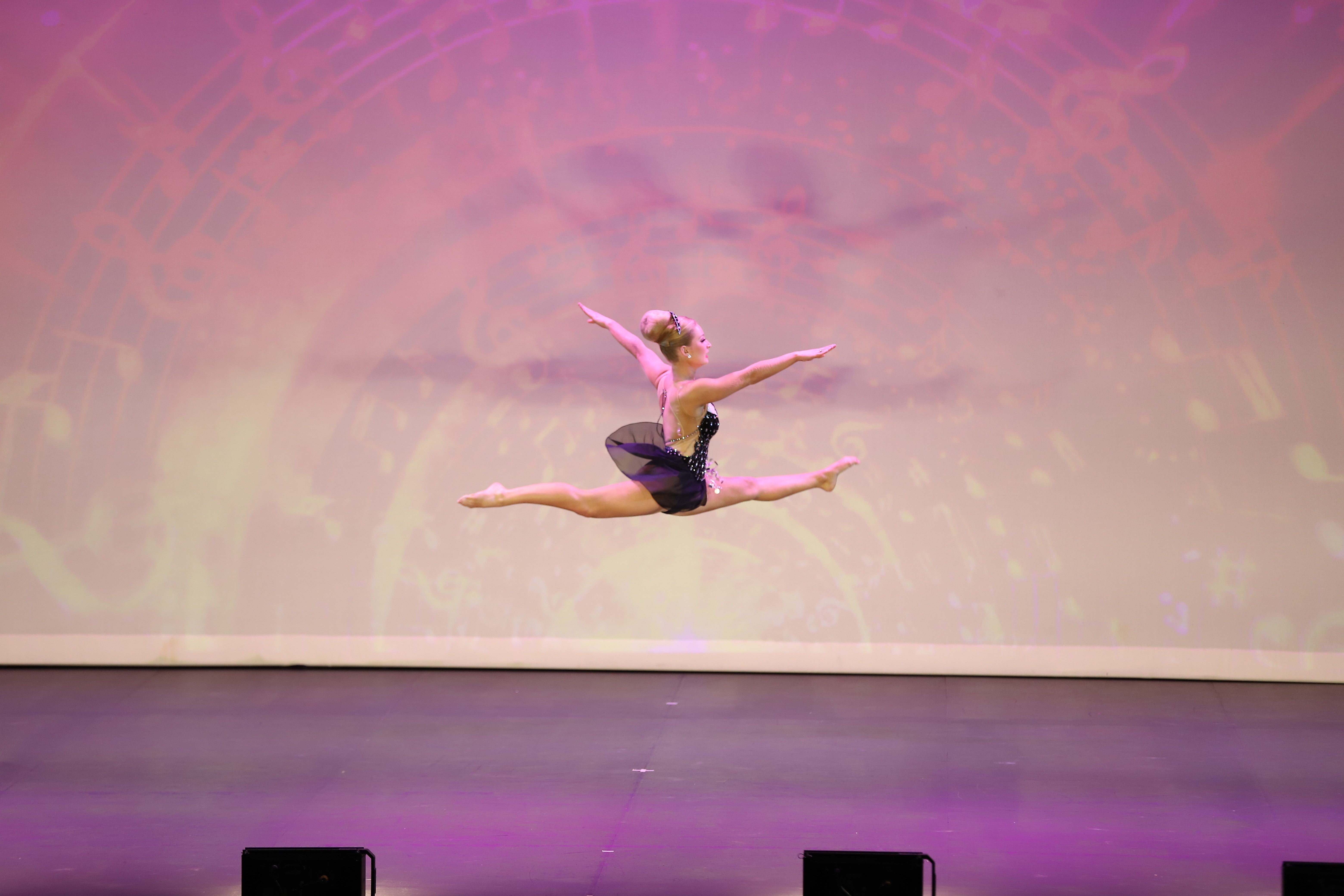 A gymnastic in flight during her routine.