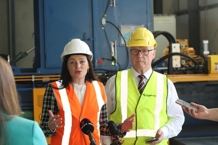 Queensland Environment Minister Leanne Linard and Sunshine Coast Mayor Mark Jamieson address media at the new recycling facility.
