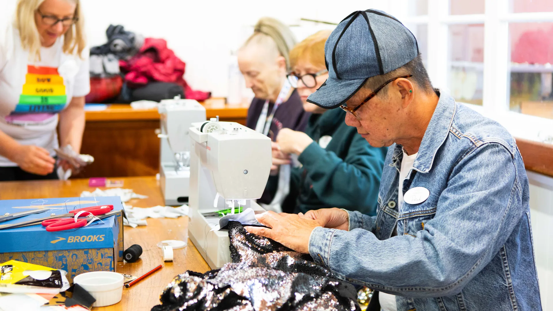 People sewing costumes