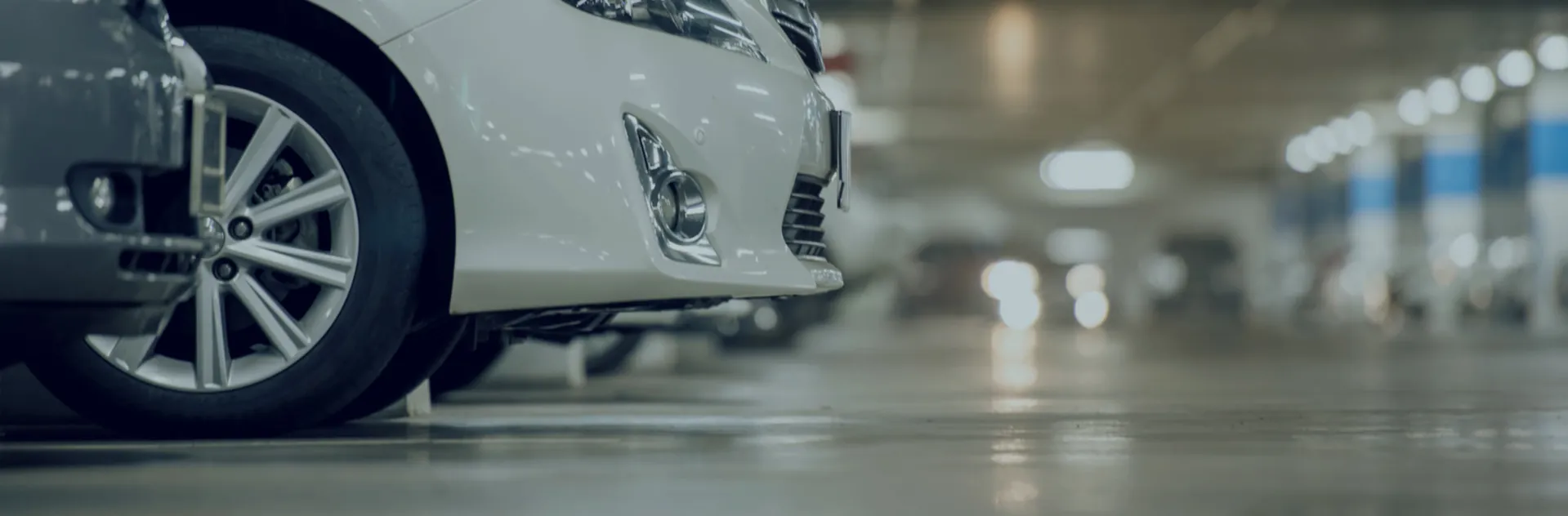 White car parked in a car park