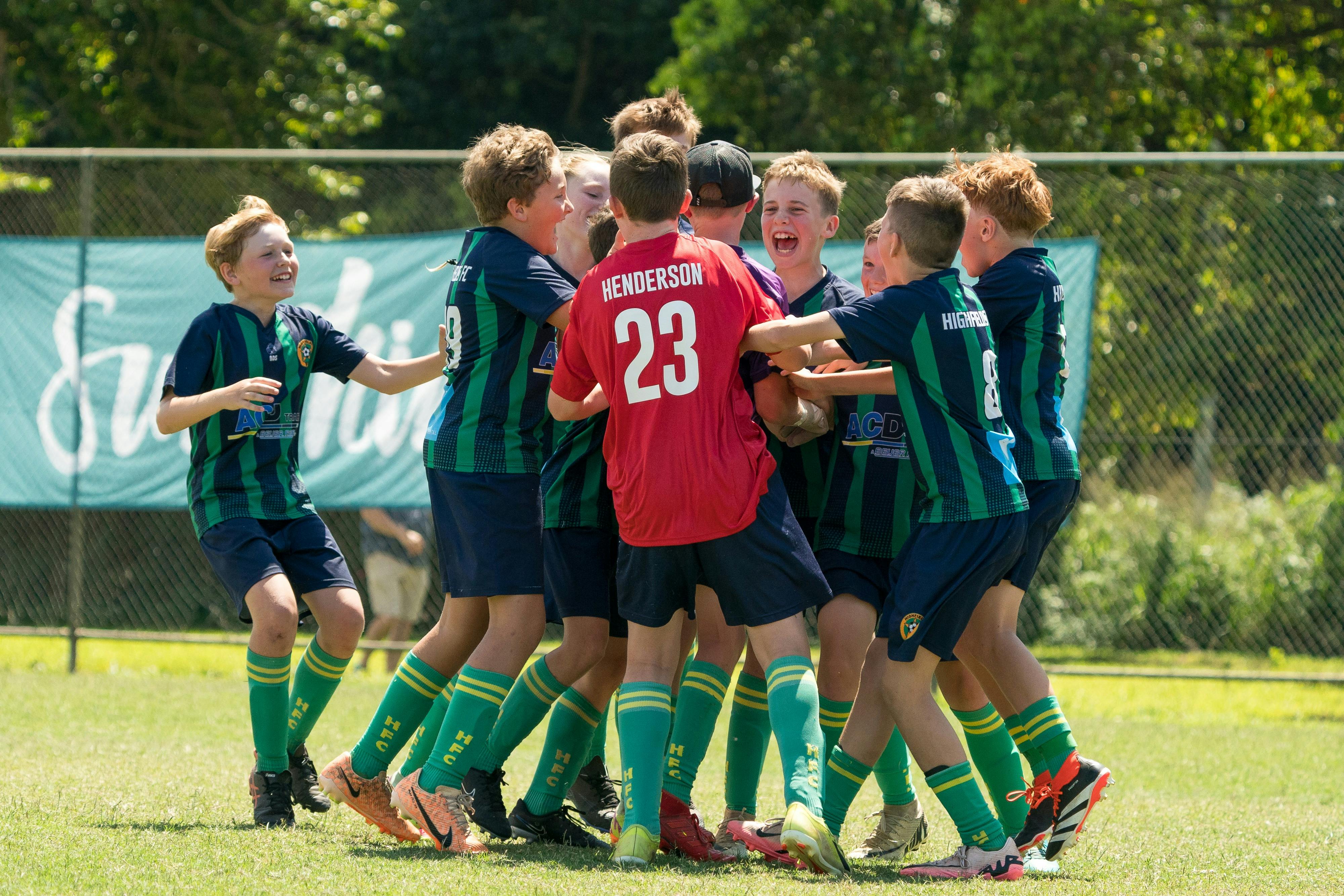 A group of young footballers in a huddle