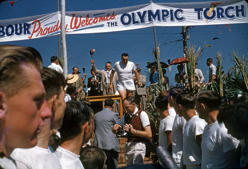 D.-A.-Low-holding-the-Olympic-Torch-on-its-arrival-in-Nambour-15-November-1956-1.jpg